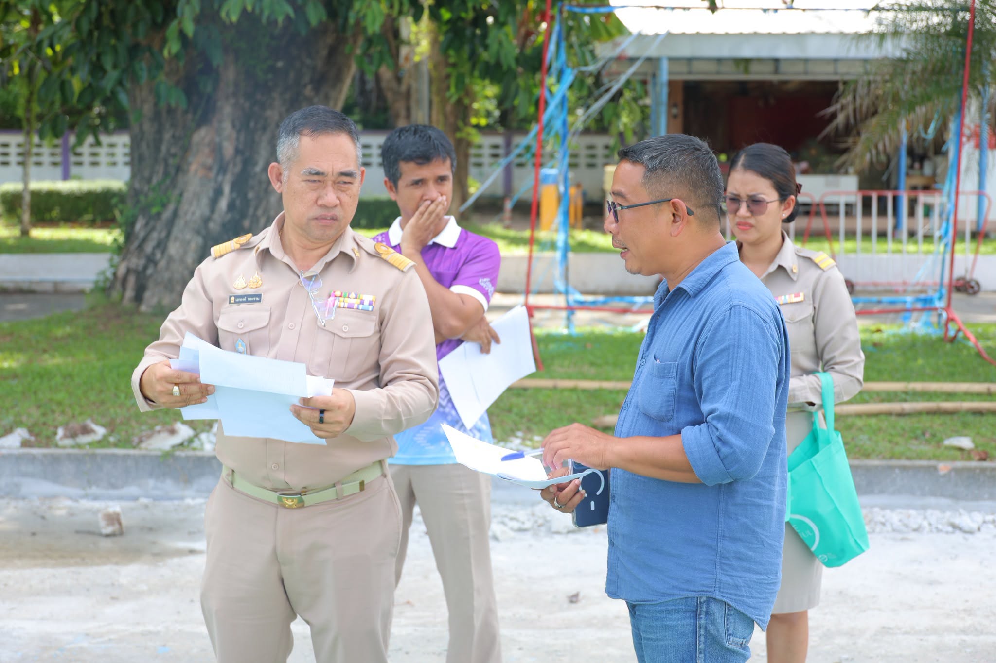การตรวจรับพัสดุงานจ้างซ่อมแซมพื้นคอนกรีตสนามบาสเกตบอล